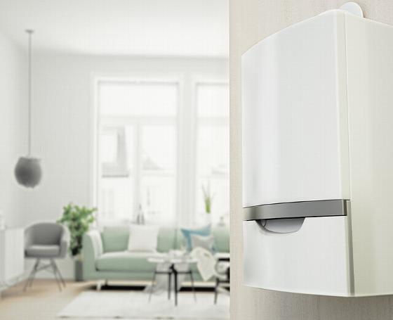 man fixing plumbing under sink while woman watches and smiles in modern bathroom with eight plumbing tools nearby