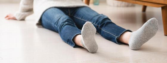 barefoot person walking on wooden floor with plants in background promoting comfort in home environments 2 steps to relaxation