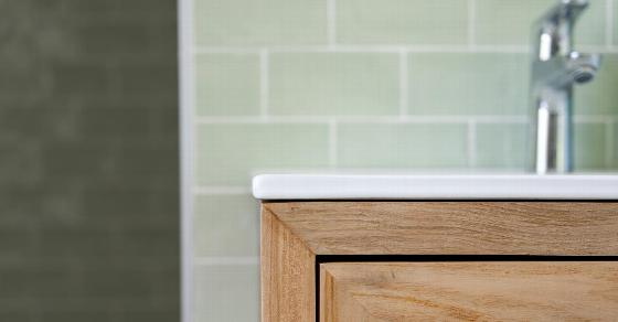 bathroom renovation with a freestanding bathtub and partially finished walls showing construction details with tools and materials scattered around the floor featuring a mirror and window in natural light ideal for 6 stylish designs